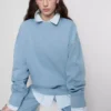 Camisola oversized com ombros caídos
