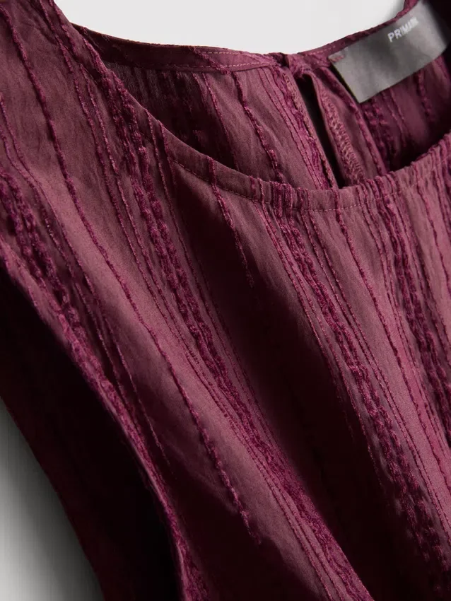 Camisola sem mangas com bainha peplum às riscas