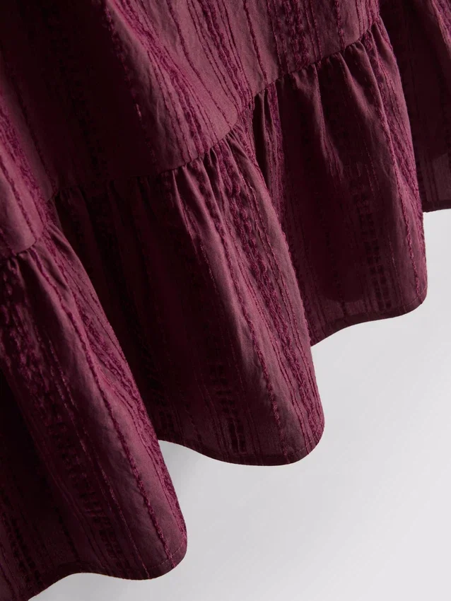 Camisola sem mangas com bainha peplum às riscas