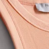 Camisola sem mangas com costas em forma de «racerback» em tecido canelado com elevada proporção de algodão
