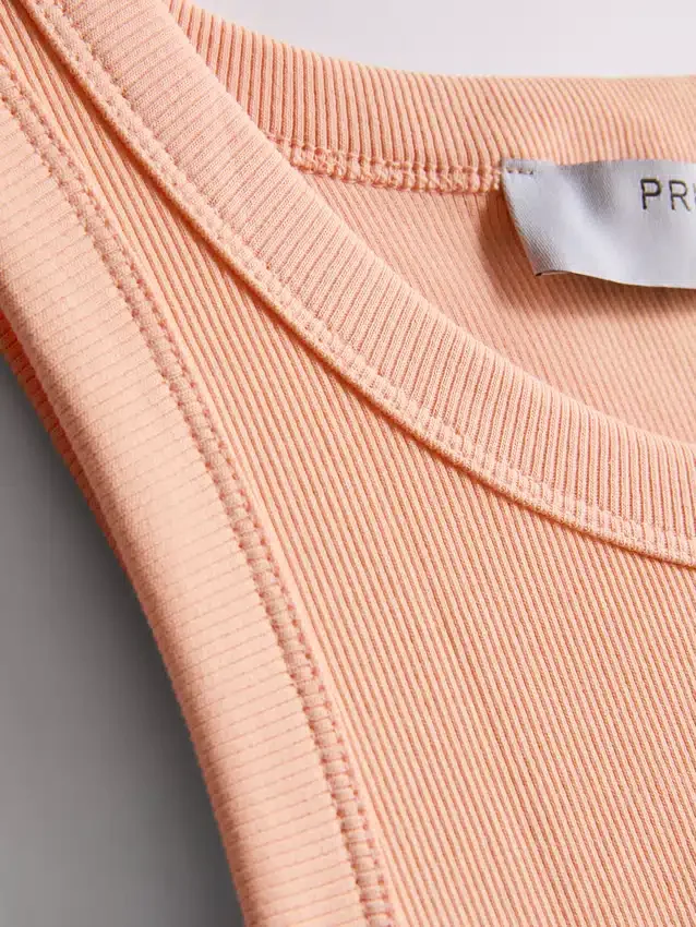Camisola sem mangas com costas em forma de «racerback» em tecido canelado com elevada proporção de algodão