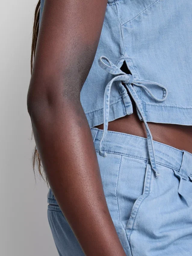 Camisola sem mangas de ganga de algodão com laço lateral