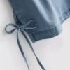 Camisola sem mangas de ganga de algodão com laço lateral