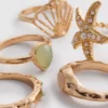 Conjunto de 5 anéis com motivos náuticos