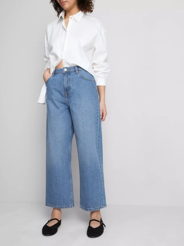 Jeans de ganga curtos de perna larga