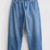 Jeans de ganga curtos de perna larga