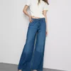 Jeans de ganga de algodão, cintura média e perna larga