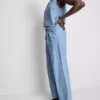 Jeans de ganga de algodão com pregas e perna larga