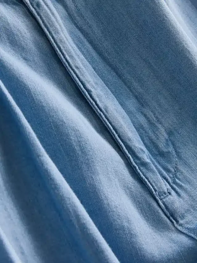 Jeans de ganga de algodão com pregas e perna larga