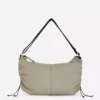 Mala tipo sling com detalhe de cordão