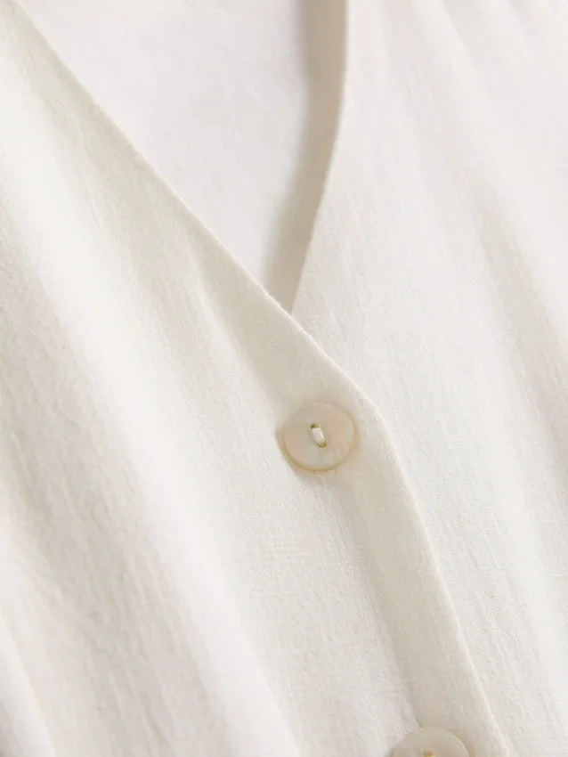 Mini-vestido sem mangas com decote em V