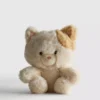 Pequeno brinquedo de pelúcia em forma de gato malhado