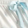 Pijamas com camisola de alças e laço em cetim estampado