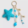 Pingente para mala em forma de estrela-do-mar