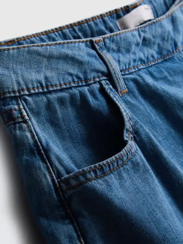 Saia-calça assimétrica em ganga de algodão