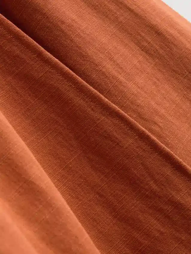 Saias midi em mistura de algodão com laço lateral
