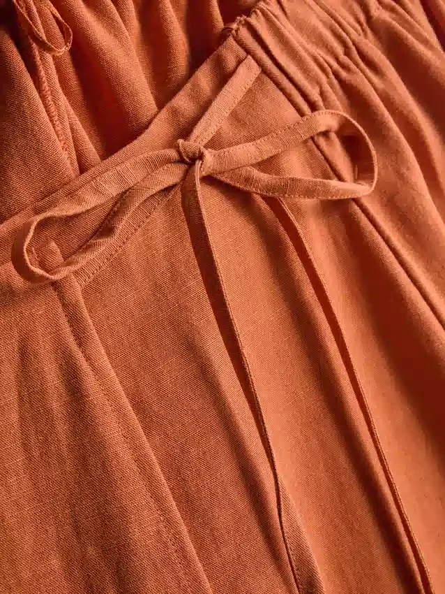 Saias midi em mistura de algodão com laço lateral