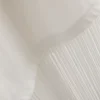 T-shirt assimétrica de algodão com franjas