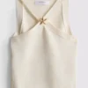 Top com decote halter e padrão de estrelas-do-mar