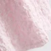Top com gola alta texturada