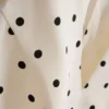 Top com peplum e decote halter às bolinhas