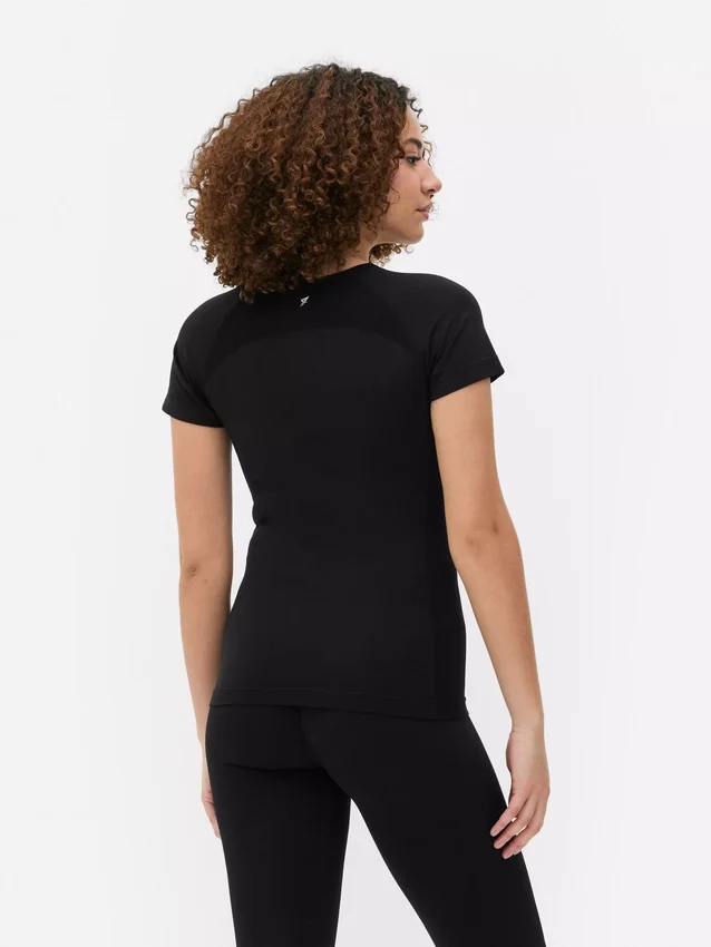 Top de desempenho sem costuras, de manga curta