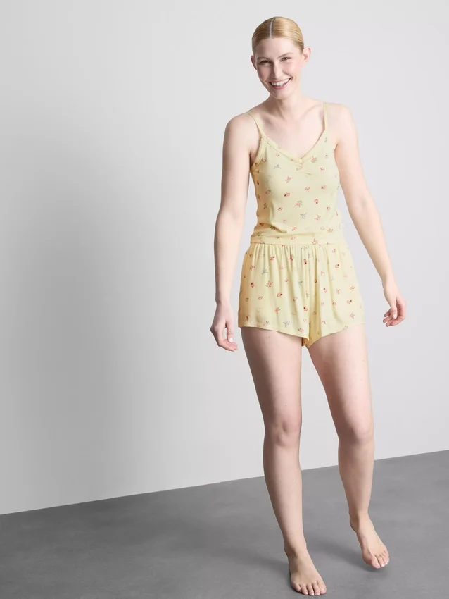 Top de pijama com alças finas e padrão floral em tecido canelado