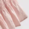 Top sem mangas com bainha peplum franzida